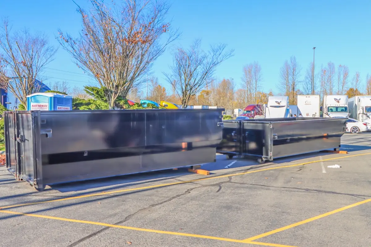 Professional dumpster rental service with roll-off container on residential driveway in Sellersburg